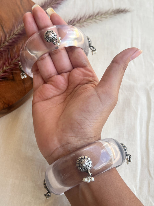 Transparent Resin bangles with silver motifs and pearl hangings