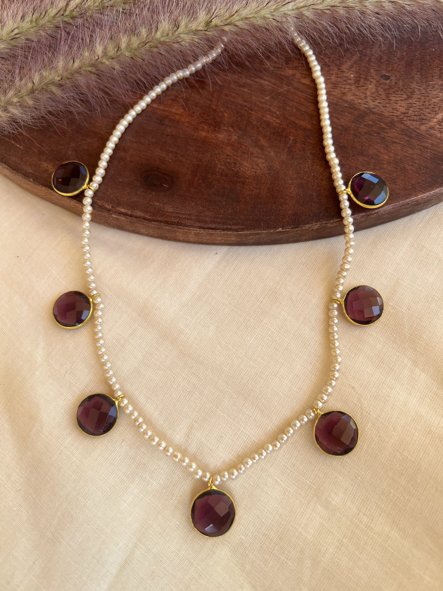 Cut stone pearl necklace