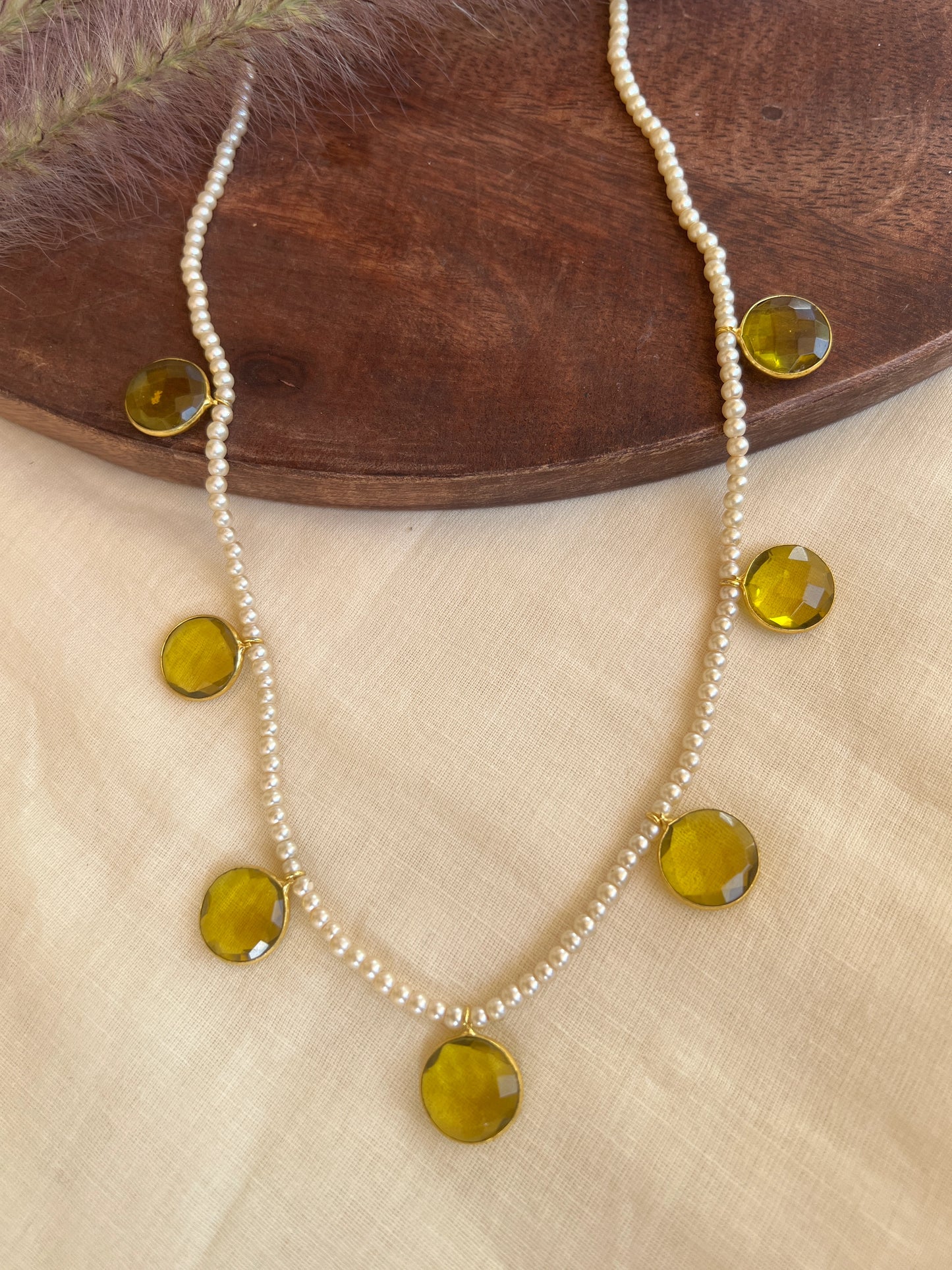 Cut stone pearl necklace