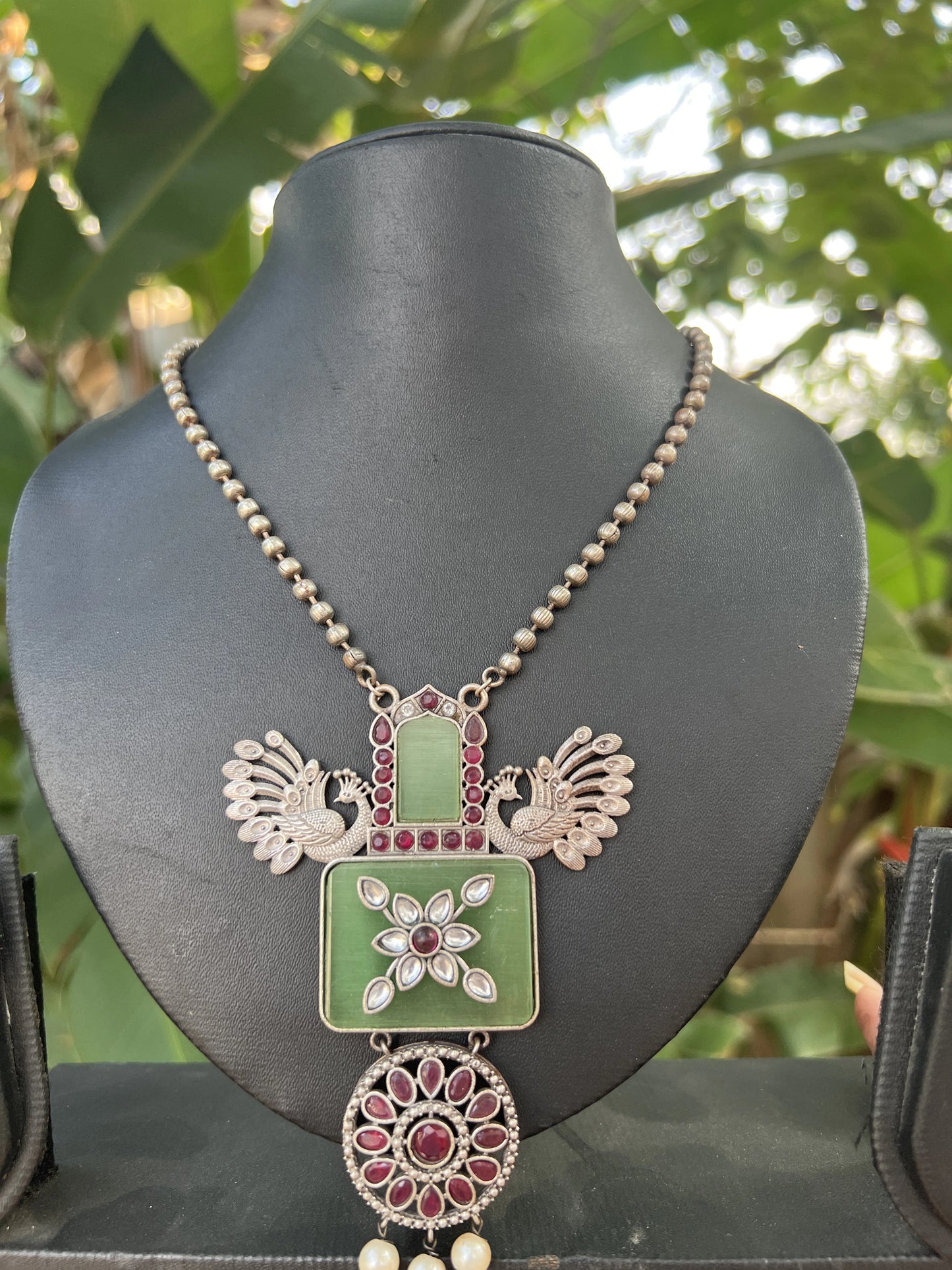 Oxidised green stone pendant set