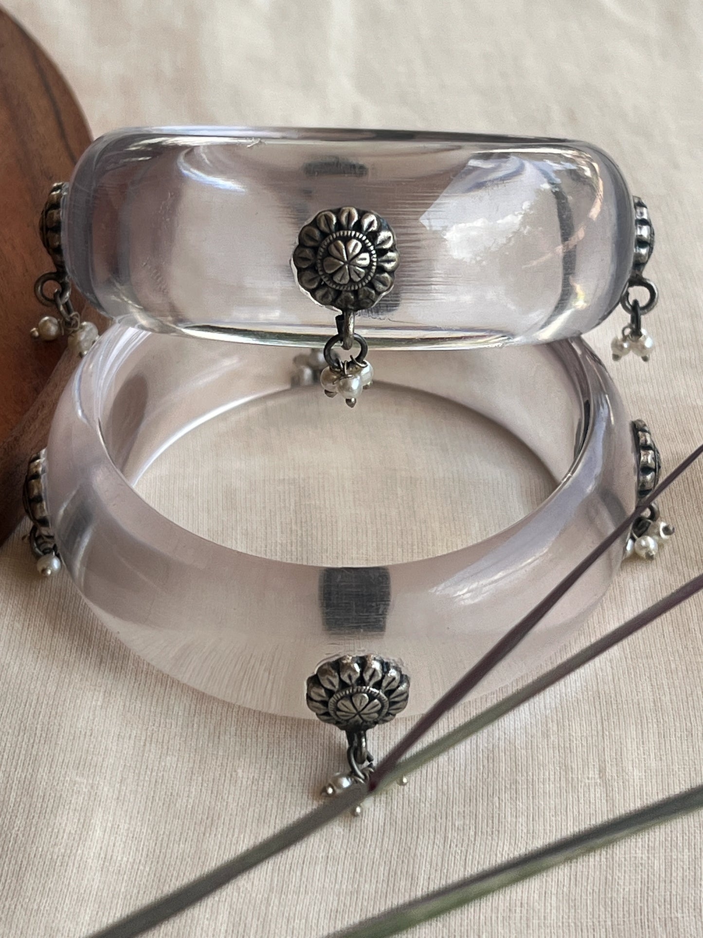 Transparent Resin bangles with silver motifs and pearl hangings