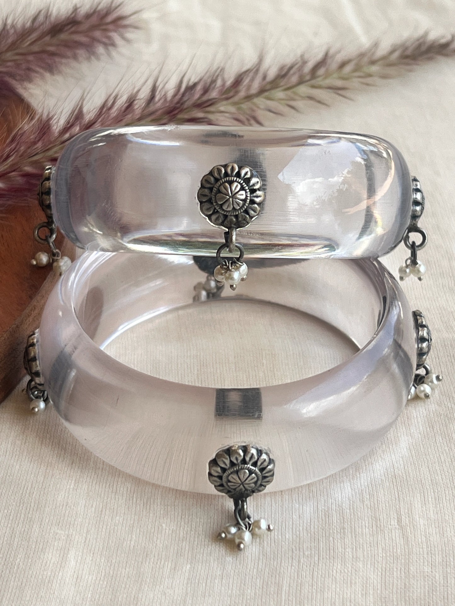 Transparent Resin bangles with silver motifs and pearl hangings