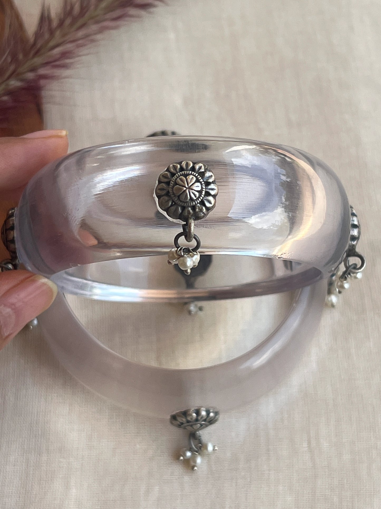 Transparent Resin bangles with silver motifs and pearl hangings
