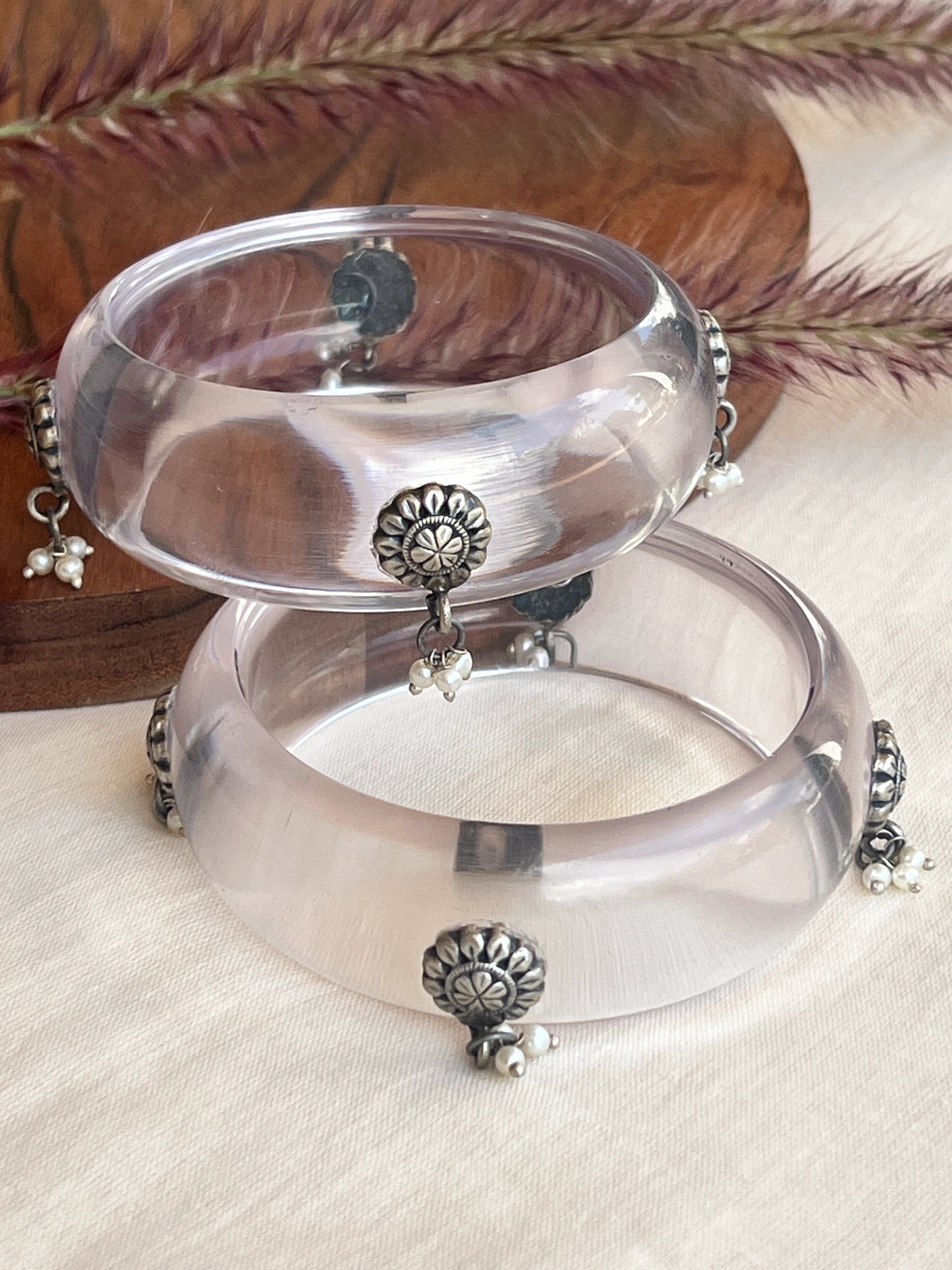 Transparent Resin bangles with silver motifs and pearl hangings