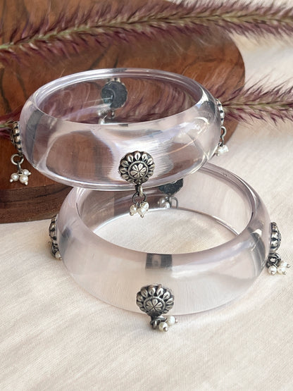Transparent Resin bangles with silver motifs and pearl hangings