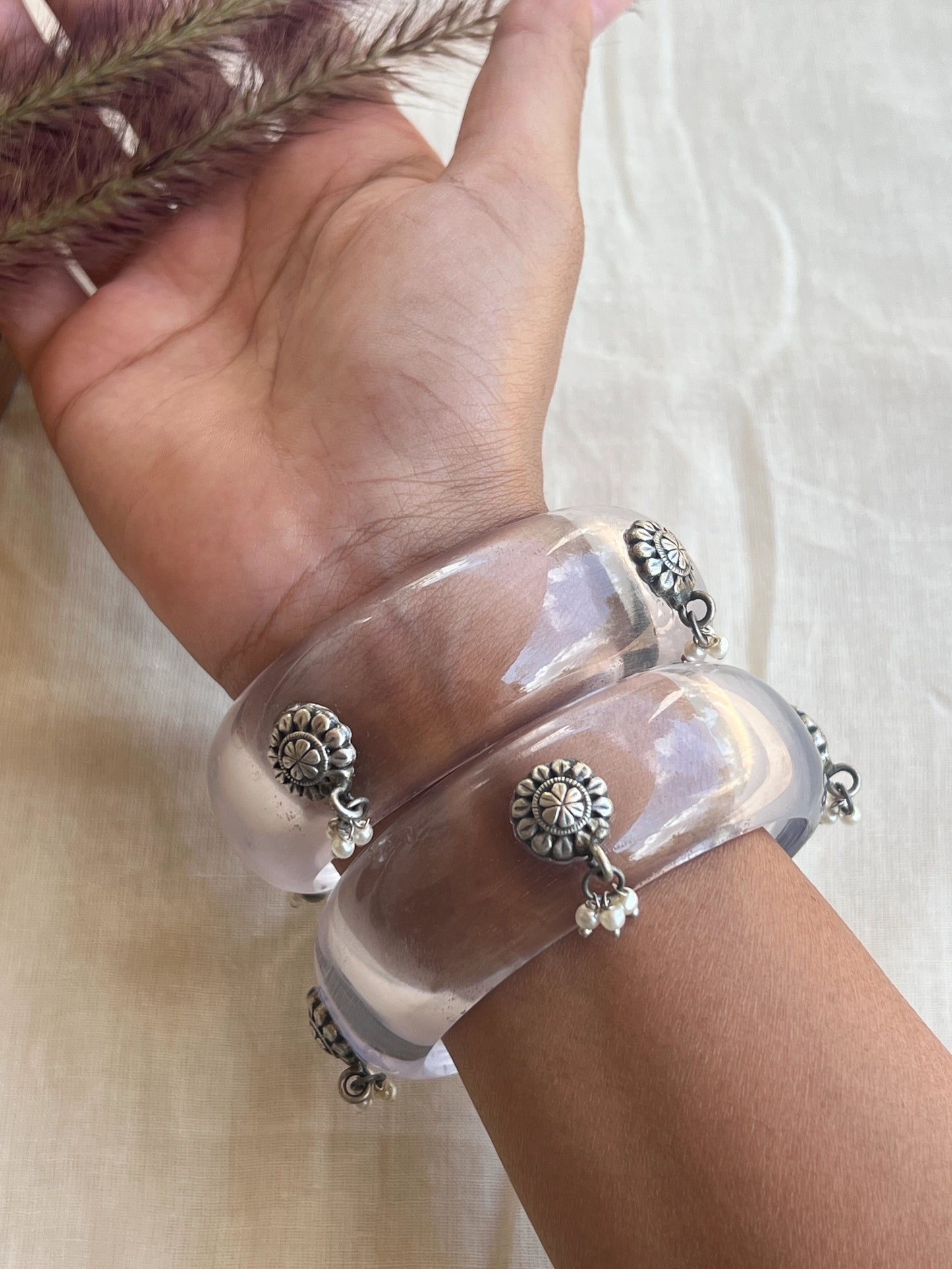Transparent Resin bangles with silver motifs and pearl hangings