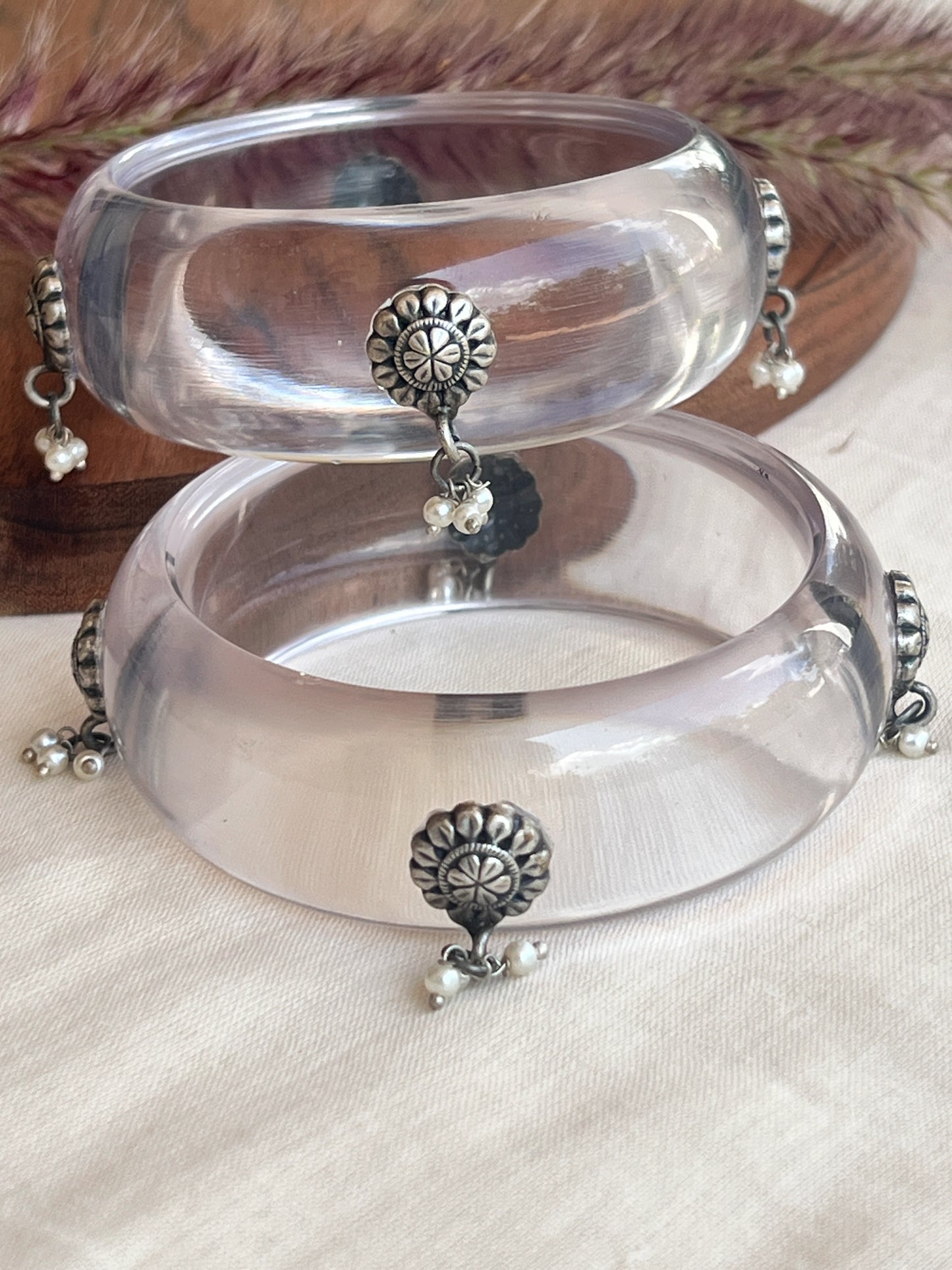 Transparent Resin bangles with silver motifs and pearl hangings