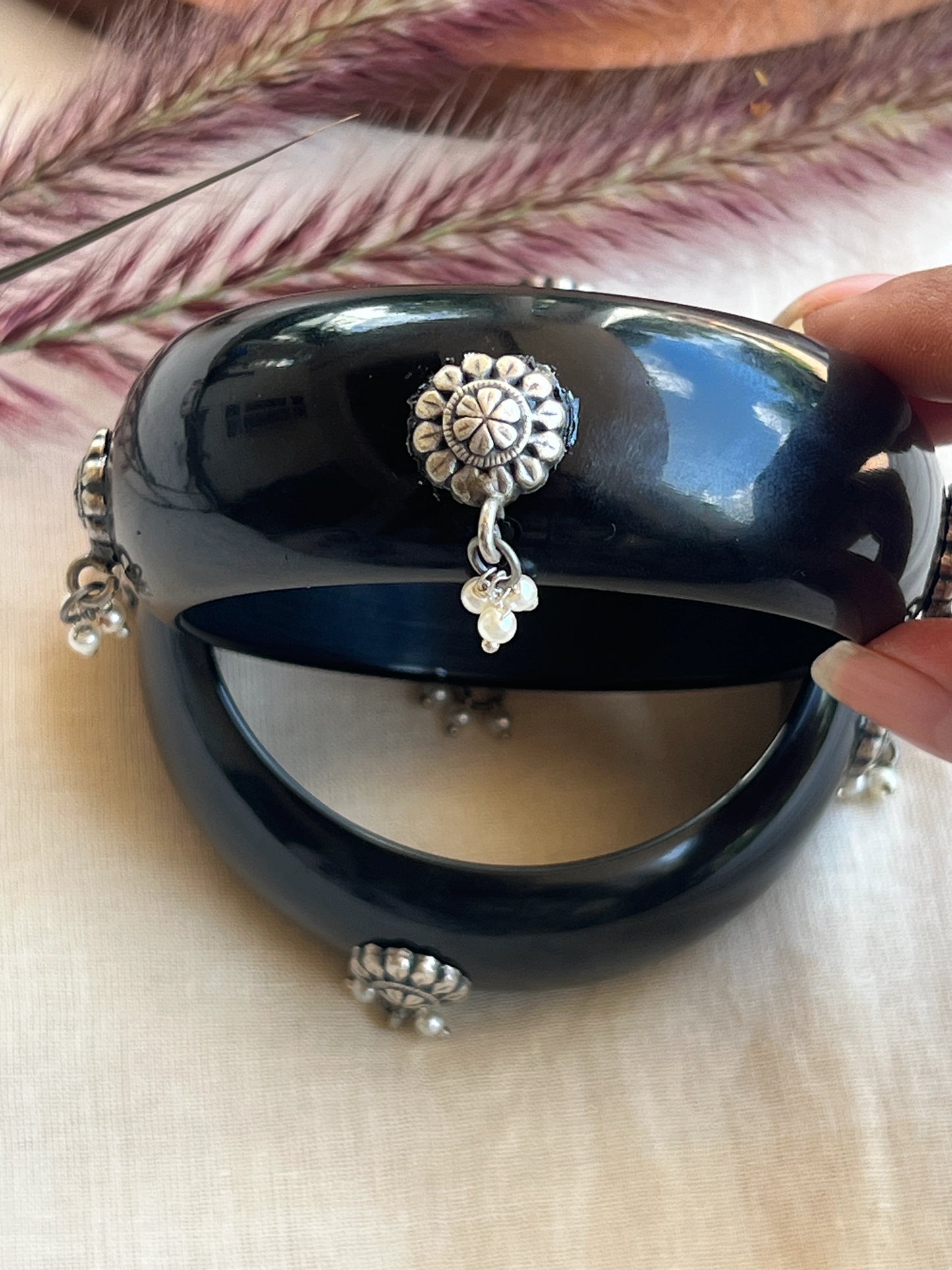 Black Resin bangles with silver motifs and pearl hangings